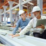 manufacturing executive recruiters Michigan Indiana Ohio - plant manager and operations director reviewing production efficiency in Midwest facility